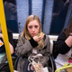 Women eating sandwiches on train